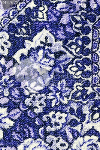 Image of Fragment of colorful retro tapestry textile pattern with floral ornament useful as background