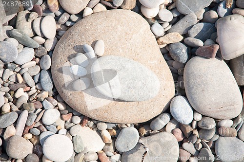 Image of sea ??stones laid out in the form of foot prints