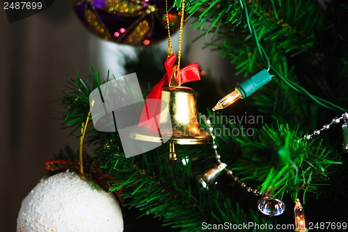 Image of christmas bell hanging on the christmas tree