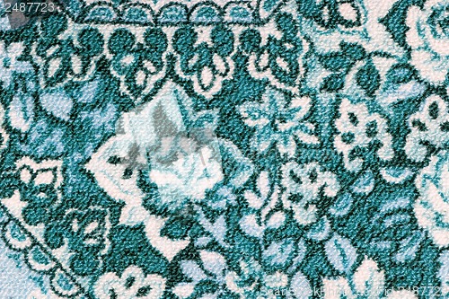 Image of Fragment of colorful retro tapestry textile pattern with floral ornament useful as background