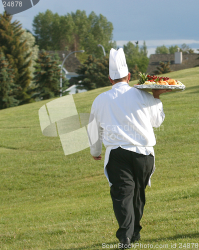 Image of chef with food tray