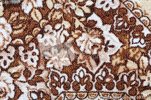 Image of Fragment of colorful retro tapestry textile pattern with floral ornament useful as background