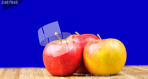 Image of apple lying on a bamboo napkin