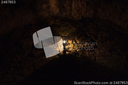 Image of torch on the wall of an old castle