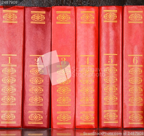 Image of Red books standing in a row