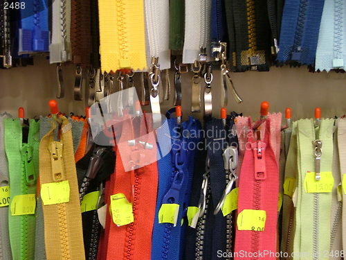 Image of assortment of hanging zippers