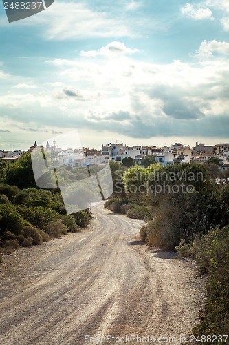 Image of empty road in sunlight blue sky destination