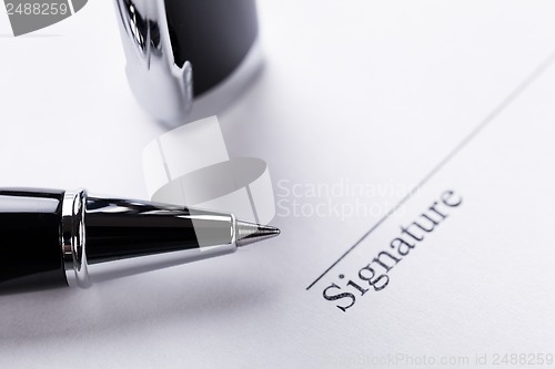 Image of macro closeup sign document contract pen filler 