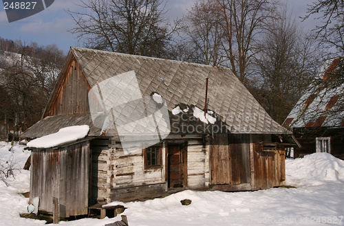 Image of Small wooden house in a village