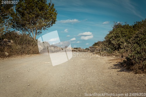 Image of empty road in sunlight blue sky destination