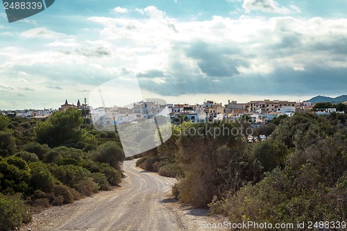 Image of empty road in sunlight blue sky destination