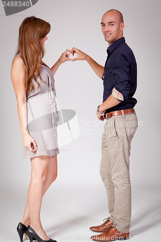 Image of young attractive couple in love embracing portrait