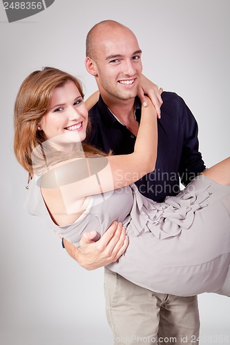 Image of young attractive couple in love embracing portrait