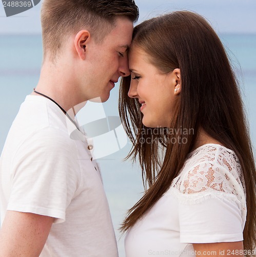 Image of attractive young couple in love having fun in summer holidays