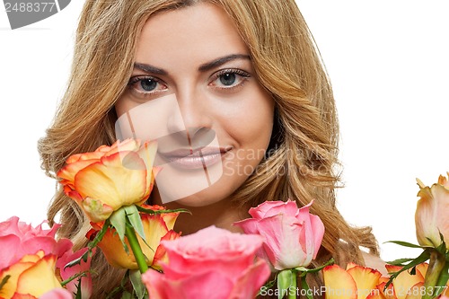 Image of attractive young smiling woman with flowers roses isolated