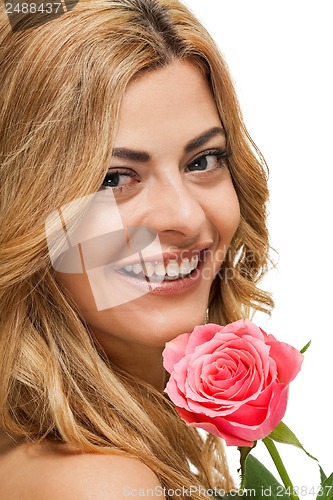 Image of attractive young smiling woman with flowers roses isolated