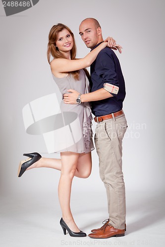 Image of young attractive couple in love embracing portrait