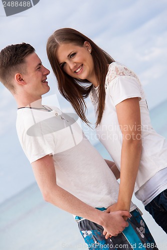 Image of attractive young couple in love having fun in summer holidays