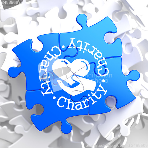 Image of Charity Concept on Blue Puzzle.