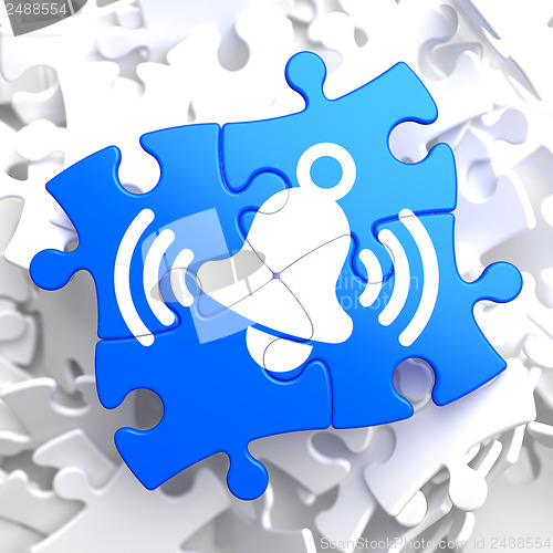 Image of Ringing White Bell Icon on Blue Puzzle.