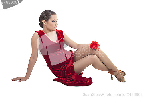 Image of Beautiful woman sitting on the floor