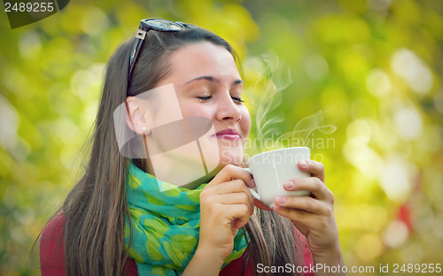 Image of Beautiful Girl enjoy a coffee in Nature