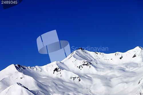 Image of Off-piste slope and blue clear sky in nice winter day