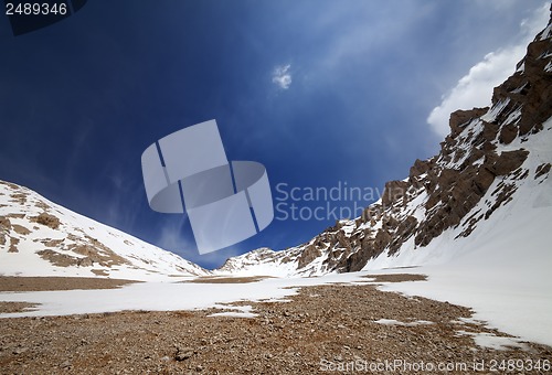 Image of Snowy rocks and blue sky