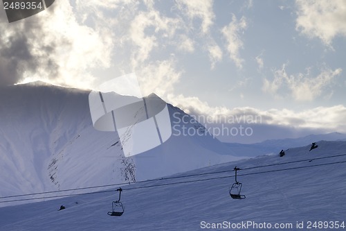 Image of Ski slope and chair-lift in evening