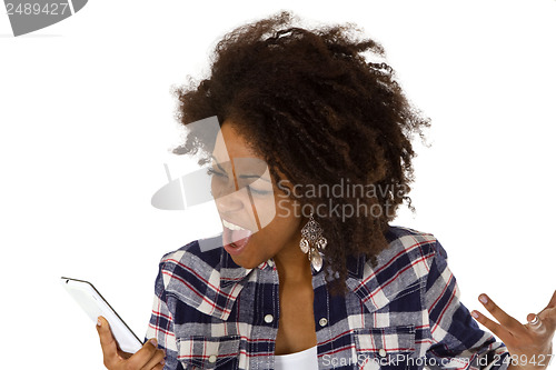 Image of Angry african american woman with cellphone