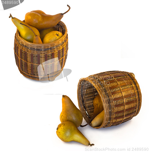 Image of Yellow pears in wicker bascet isolated on white