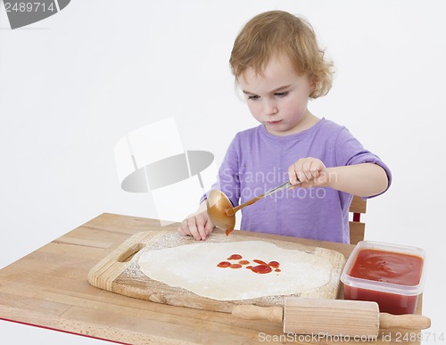Image of girl making pizza