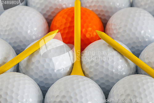 Image of Golf balls and wooden tees