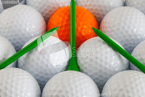 Image of Golf balls and wooden tees