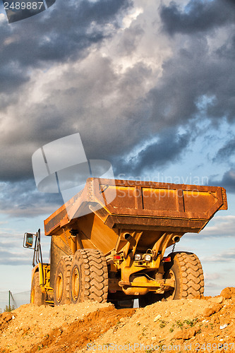 Image of Heavy mining truck at sunset