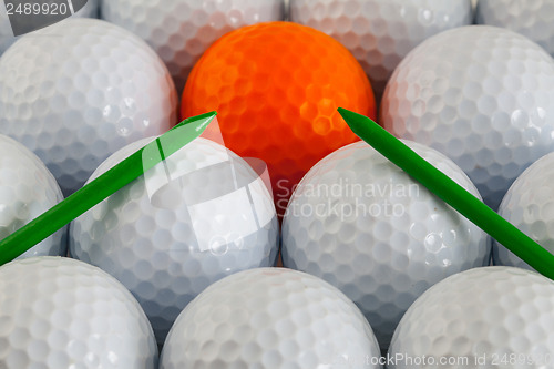 Image of Golf balls and wooden tees