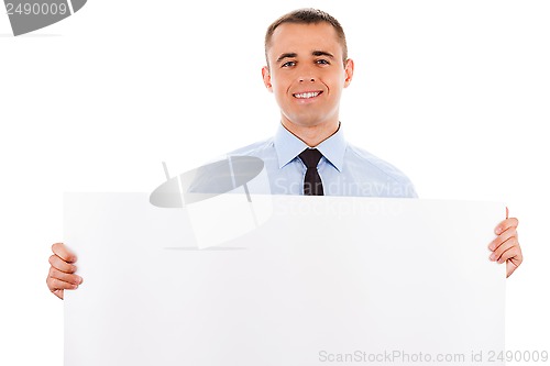 Image of businessman holding white placard