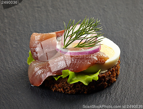 Image of canape with anchovy and egg