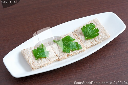 Image of Diet bread with parsley on a plate