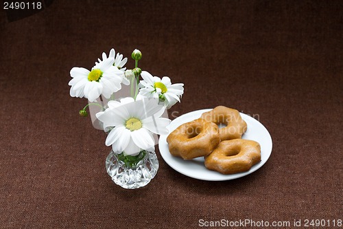 Image of cookies in a plate on a background of burlap