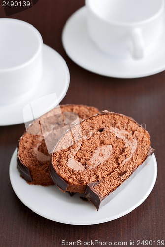 Image of two slices of tasty chocolate cake on a plate