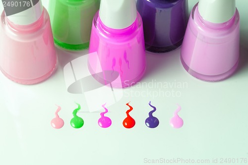 Image of Bottles with spilled nail polish