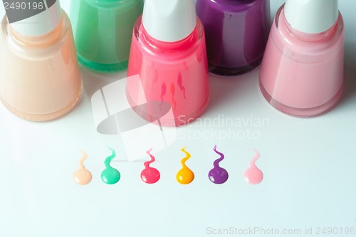 Image of Bottles with spilled nail polish