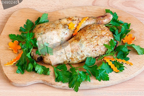Image of Fried chicken legs with parsley on the board
