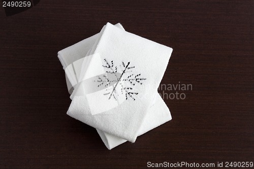 Image of Warm knitted socks on wooden table close-up