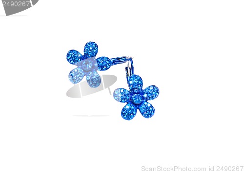 Image of blue earrings in the shape of flowers on a white