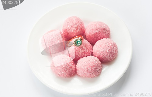 Image of pink marmalade and engagement ring