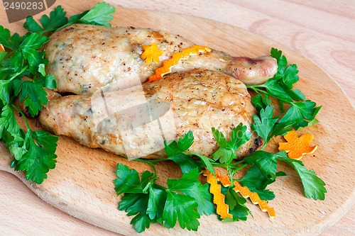 Image of Fried chicken legs with parsley on the board