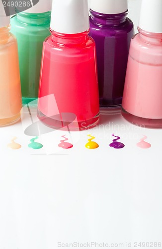 Image of Bottles with spilled nail polish