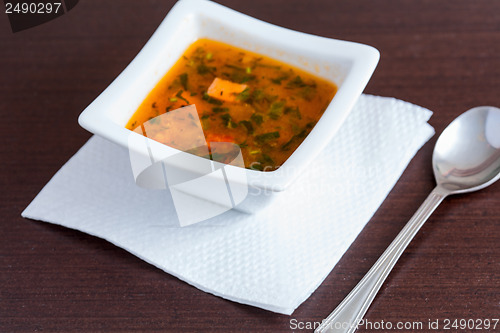 Image of Chicken soup in the white ceramic bowl